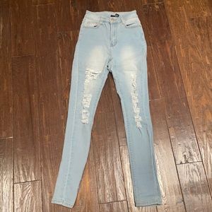 distressed blue jeans high waisted